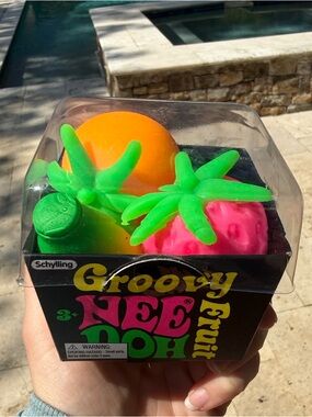 Needoh Groovy Fruit Set - Bright Orange, Strawberry, and Banana.